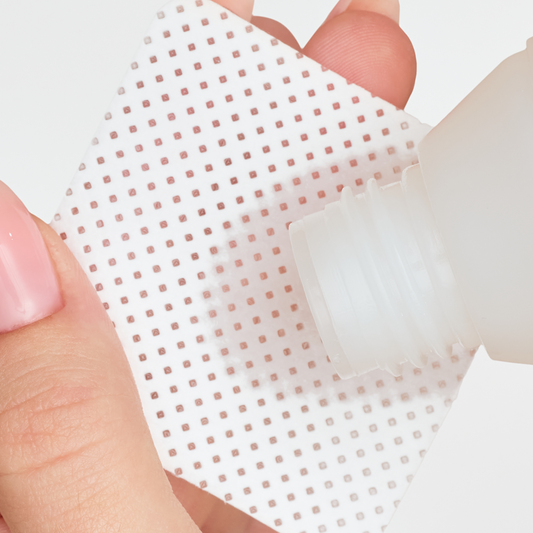 Cleaner poured onto a wipe – proper prep keeps gel polish from peeling