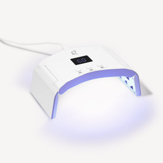 The SmartFold UV/LED lamp switched on – curing gel nails